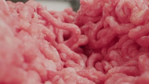 Raw Minced Meat Macro Probe Lens Beef or Pork Red Minced Burger Meat Close Up Tunnel Rotation