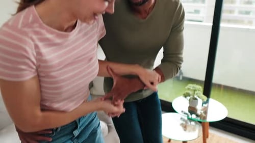 Couple Dancing and Laughing in Living Room