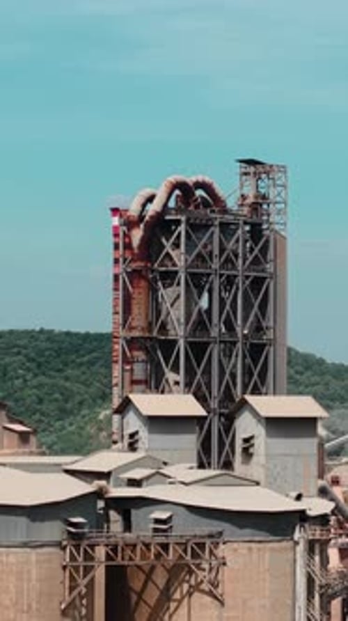 Industrial Cement Factory Plant with Smokestacks
