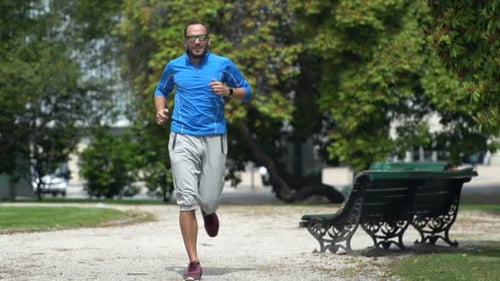 People Jogging in City Park Active