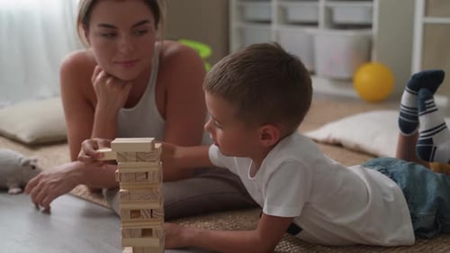 Mother and Son Playing Block Tower Game
