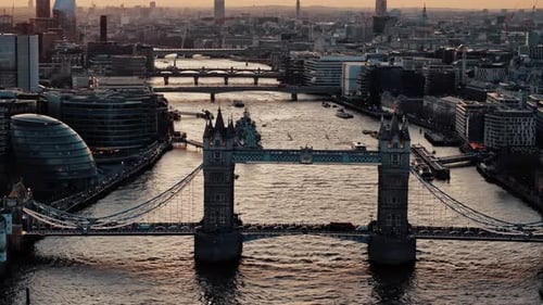 Rightward Drone Glide of London Tower Bridge at Sunset with Traffic and Boat