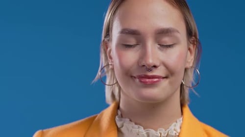 Smiling Young Adult in Yellow Blazer Close Up