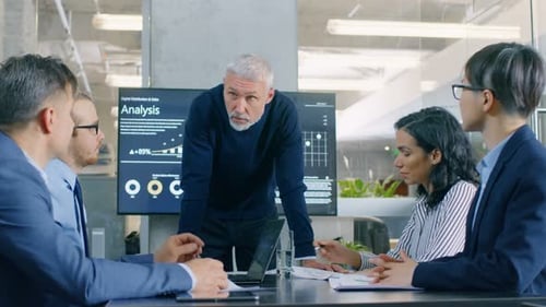 Business Team Meeting to Review Financial Analysis