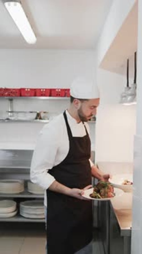 Smiling Chef Displaying Beautiful Plates of Food