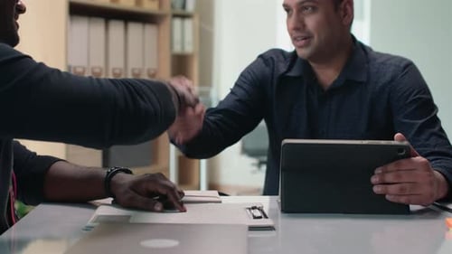 Men Shaking Hands in Office Workplace