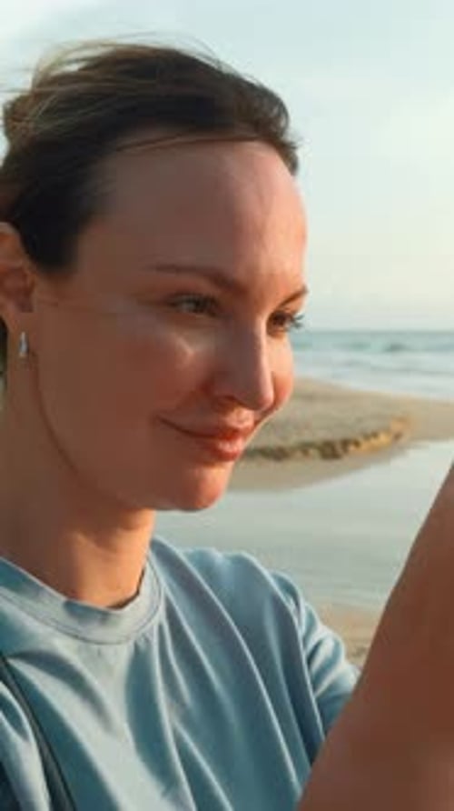 Pretty Young Caucasian Woman Takes Pictures of the Beautiful Sea on Tropical Island Beach Action