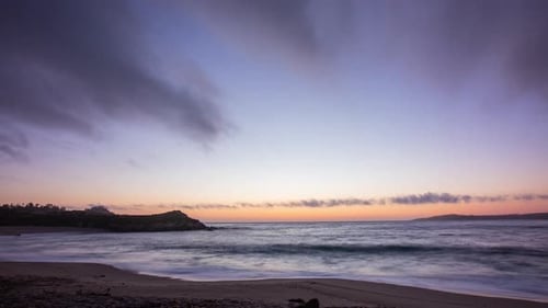 Timelapse - Dramatic and colorful sunset clouds at a California beach