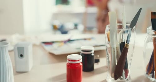 Close-up selective focus on foreground painting equipment color water, oil and acrylic brush.