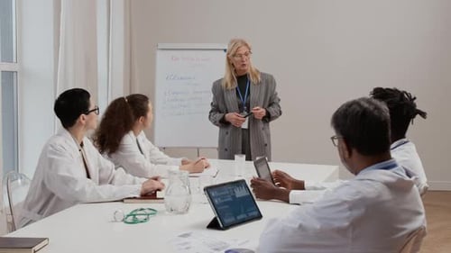 Medical Professionals Meeting for Clinical Discussion in Office