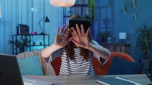 Woman Experiencing Immersive Virtual Reality Gaming at Home