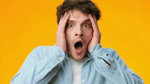 Man with Brown Hair Displays Shock and Surprise
