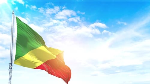 Dynamic Green Yellow Red Flag Waving Against Sunny Sky