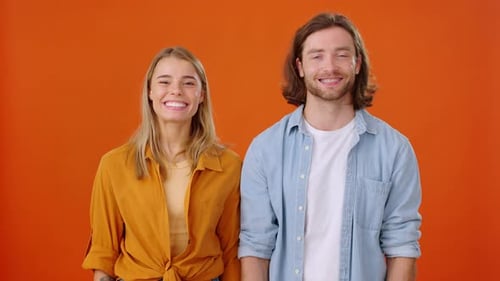 Man and Woman Listen to Interlocutor Crossing Arms at Meeting