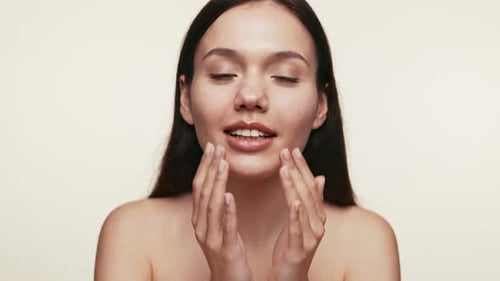 Woman Massages her Face in a Beauty Routine