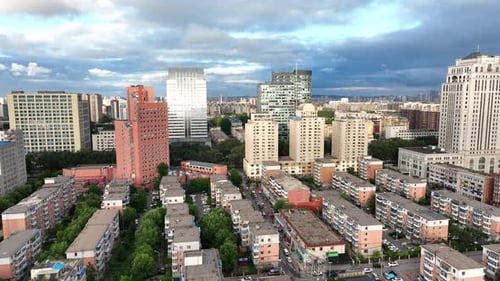 Aerial view of tall buildings and streets, China.