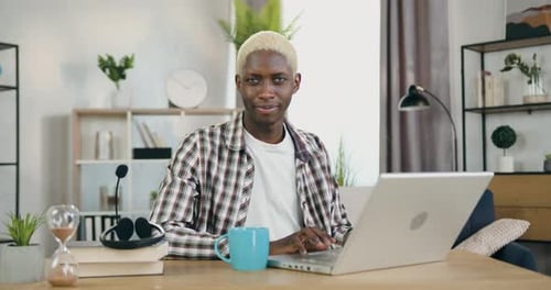 Close up of cute positive man which looking into camera and specific face expression