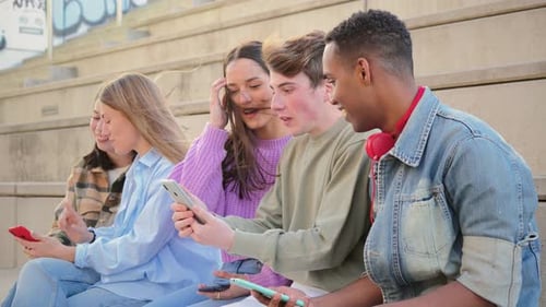 Group of Friends Using Phones on Outdoor Steps