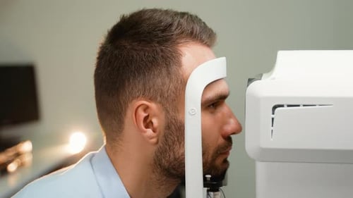 A Man Checking Eye Vision On Optometry Equipment Eyesight Exam