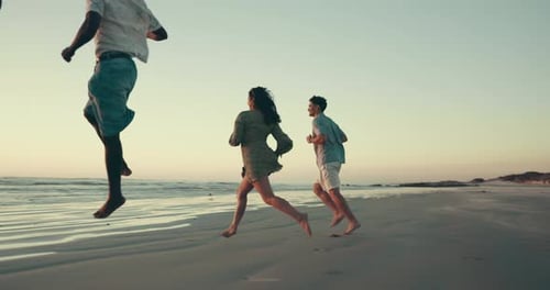 Running, friends and people on beach at sunset for holiday, summer vacation and adventure together