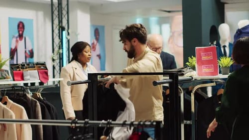 Shoppers Browse Clothes During Black Friday Sale