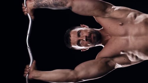 Fit and Sporty Bodybuilder Over Black Background Bodybuilder Training Using Barbell The Concept of