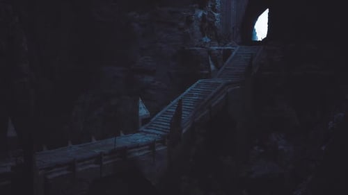 Ancient Cave Stairs Leading to Bright Exit