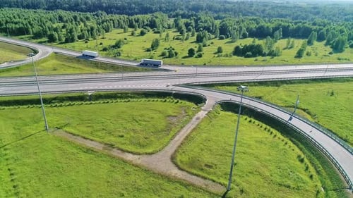 Transport Interchange on the Highway Aerial of Cars Drive Along the Highway Outside the City