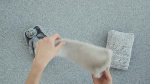 Knitted Baby Clothes and Toys Flat Lay