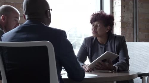 Business People with Digital Tablet Meeting in Office Adult