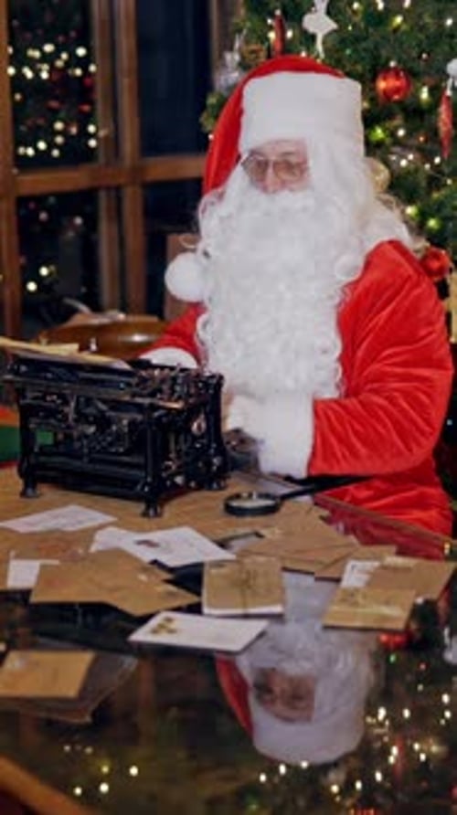 Santa Claus Types Letters on Typewriter at Christmas