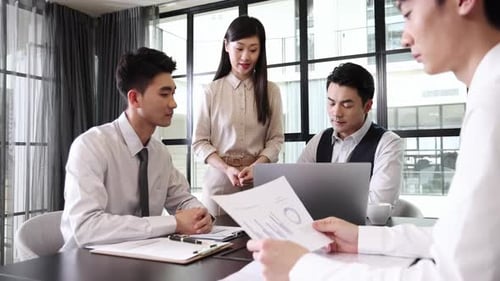 A female presenter shares crucial data analysis, actively engage productive office meeting, analyzin