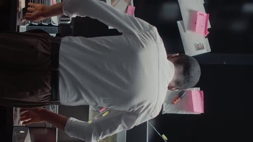 Man Investigating Crime at Desk with Evidence