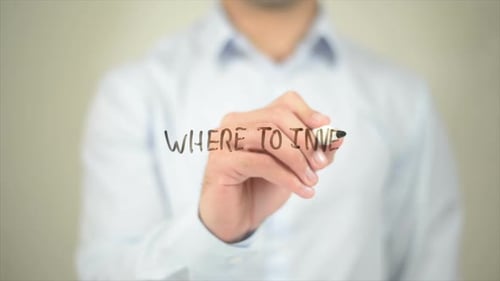 Man Writes "Where to Invest" On Clear Surface