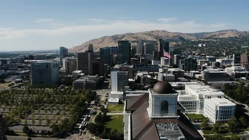 Aerial View of City Skyline with American Flag