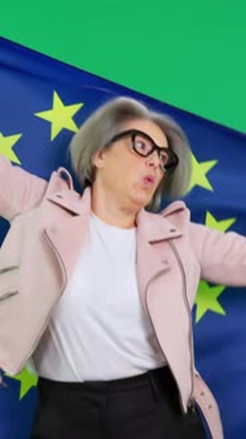 Woman in Front of Green Screen Holding EU Flag