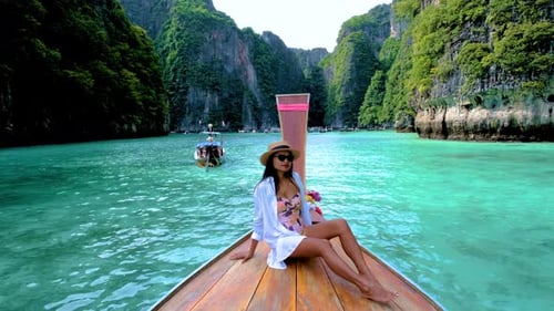 Pileh Lagoon with Green Emerald Ocean at Koh Phi Phi Thailand Women in Front of Longtail Boat