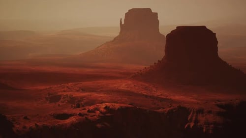 Une majestueuse formation rocheuse émergeant d'un paysage désertique aride