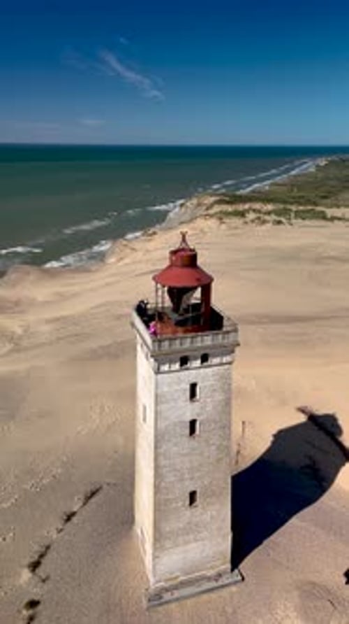 Explore Rubjerg Knude Lighthouse Overlooking the Stunning Coastline of Denmark