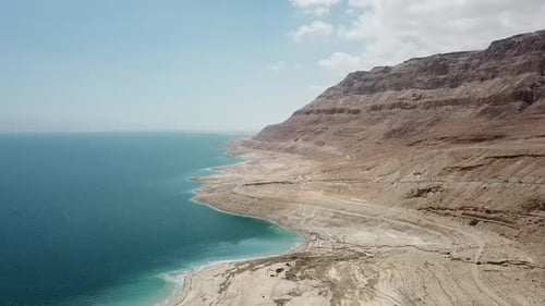 Aerial View Of Beautiful Mountain By Dead Sea Against Sky During Sunset, Vehicles Moving On Road