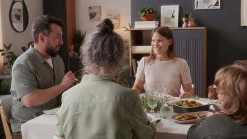 Multi-Generational Family Enjoying Meal Together at Home