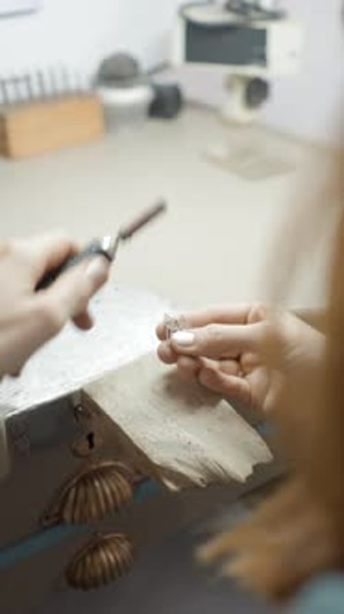 Jeweler Works on Jewelry with Power Tool