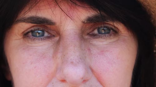 Close Up to Upset Female Face Looking Into Camera with a Disappointing Sight Upset Facial Expression