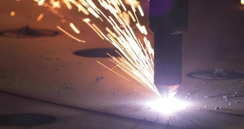 Sparks from the work of the installation for cutting metal