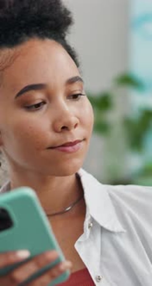 Woman Uses Phone with Credit Card for Online Shopping