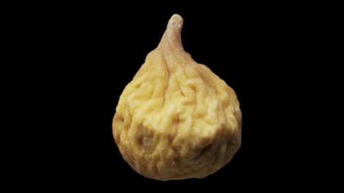 dried figs rotate, on a black background close-up. In move
