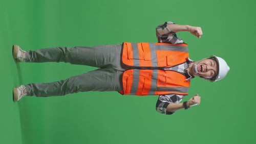 Asian Male Engineer With Safety Helmet Screaming Goal Celebrating Working In The Green Screen
