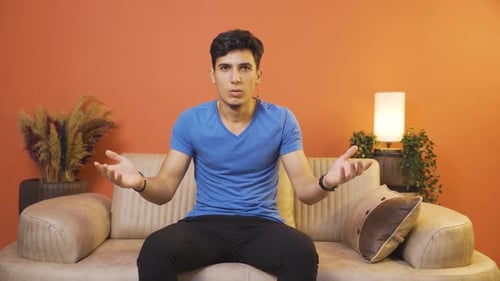 The man says wow to the camera.