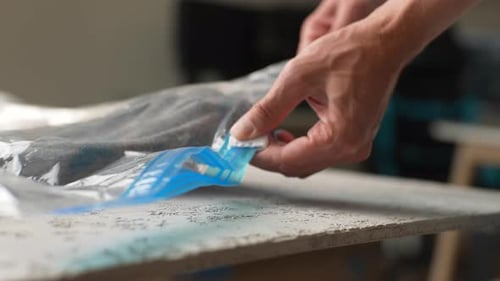 Hands sealing a clear plastic storage bag