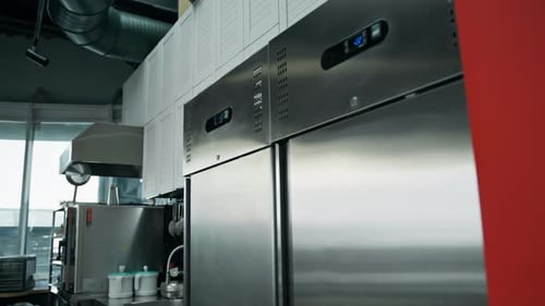 Professional commercial empty clean modern kitchen in restaurant or cafe Metal kitchen equipment
